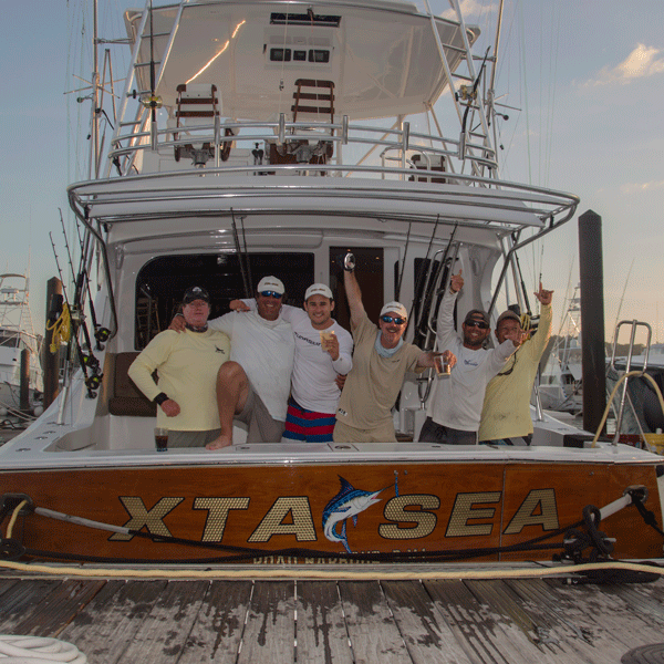 xtasea team xta sea on back of boat